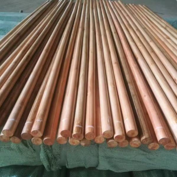 Neatly stacked polished varnished wooden broom handles from customized handle equipped garden broom factory, ideal for garden broom assembly