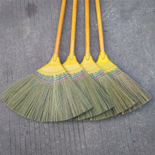 Finished grass brooms with wooden handles, made with quality materials from reliable grass broom raw material suppliers