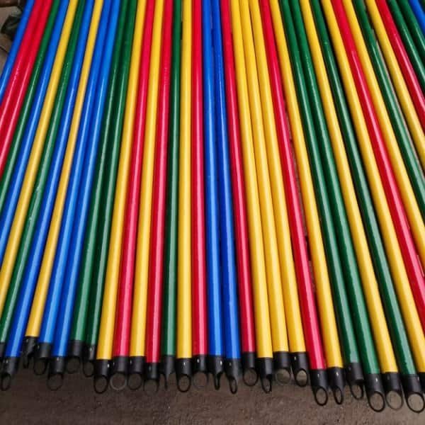 Wood broom handle sticks in vibrant colors with black plastic caps