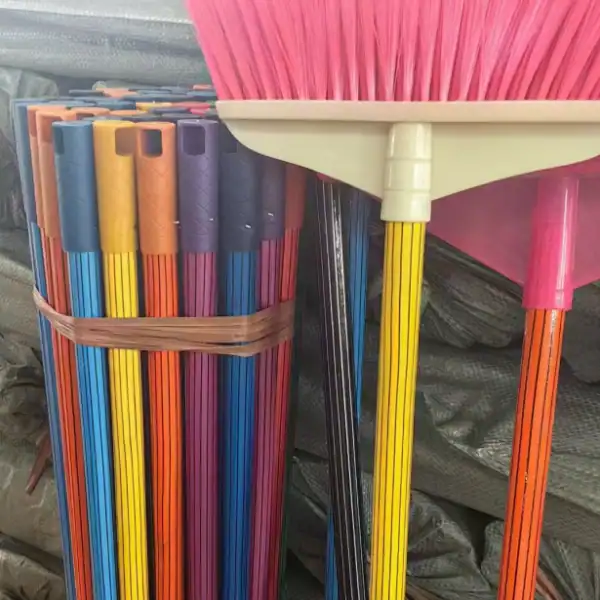 Colorful coated broom handles showing proper broom handle diameter for secure attachment to broom heads, ideal for retail and bulk orders