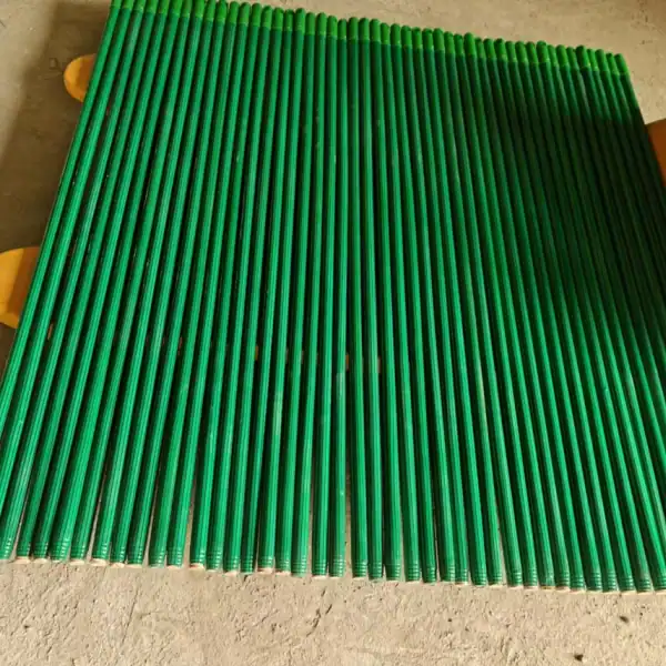 Green PVC coated wooden broom sticks supplied by pvc coated wooden broom stick manufacturers, wooded cleaning tool handles