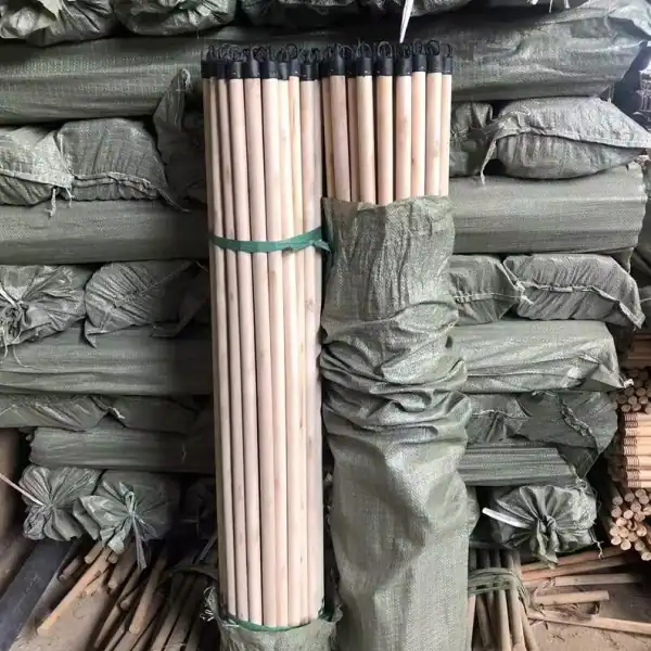 Plain eucalyptus broom stick factory warehouse stock, bulk wooden broom handles packed in woven bags for global wholesale importers