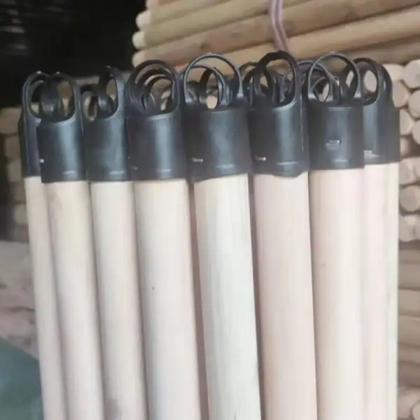 Bulk plain broom stick unfinished eucalyptus wooden poles fitted with black plastic hanging caps for cleaning tools
