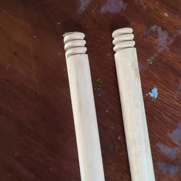 OEM mexican thread wooden broom stick, close-up view of finished eucalyptus broom handles with standard mexican thread for wholesale buyers