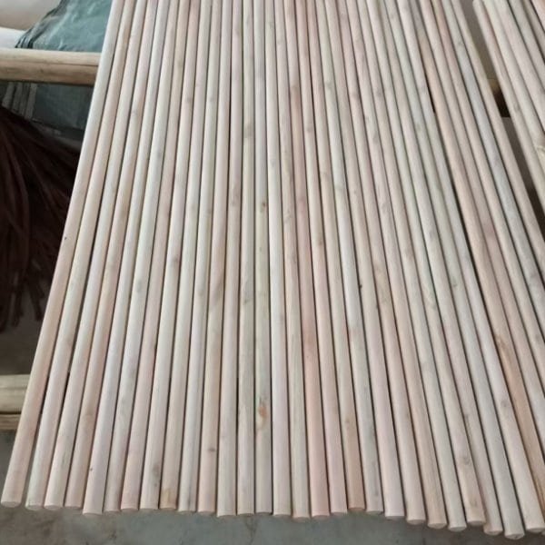 Mexican thread broom stick factory, neatly sorted raw eucalyptus wooden broom sticks ready for threading and bulk export