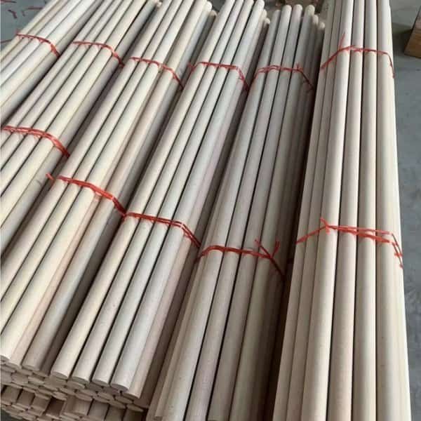Bundled raw beech wood round sticks ready for processing by cnc machining wood handle manufacturer for custom wooden handle production