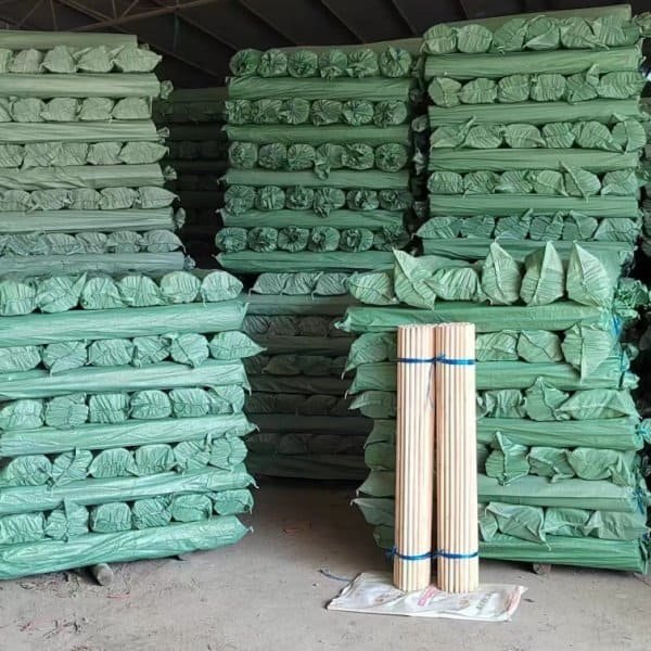 Warehouse bulk stock of packed natural wooden broomsticks, broomstick manufacturers south africa, China factory export ready wooden broom handles